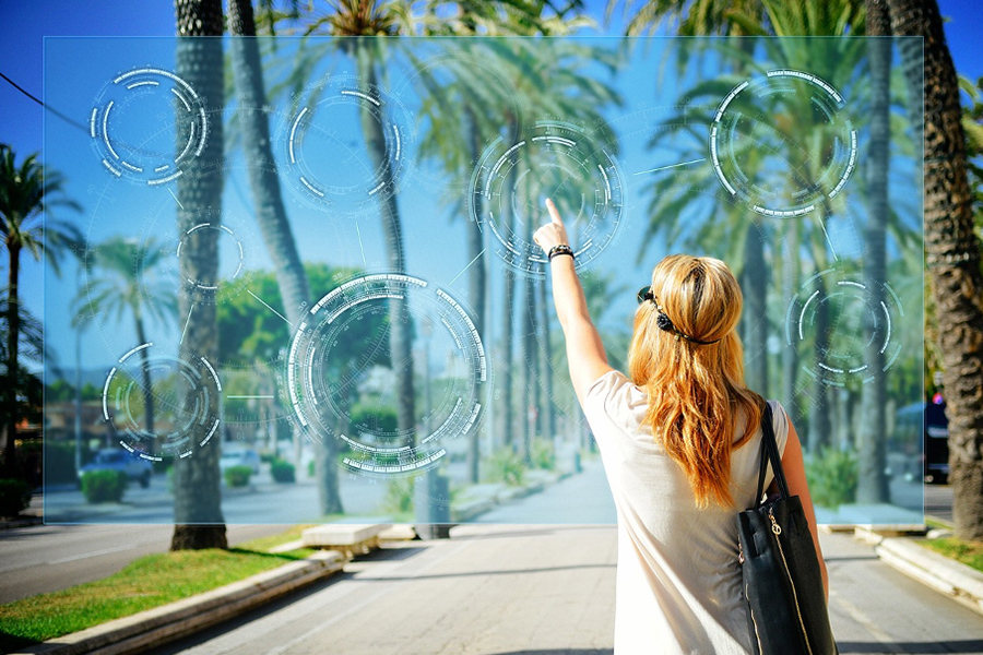 A woman touching an icon on a virtual screen